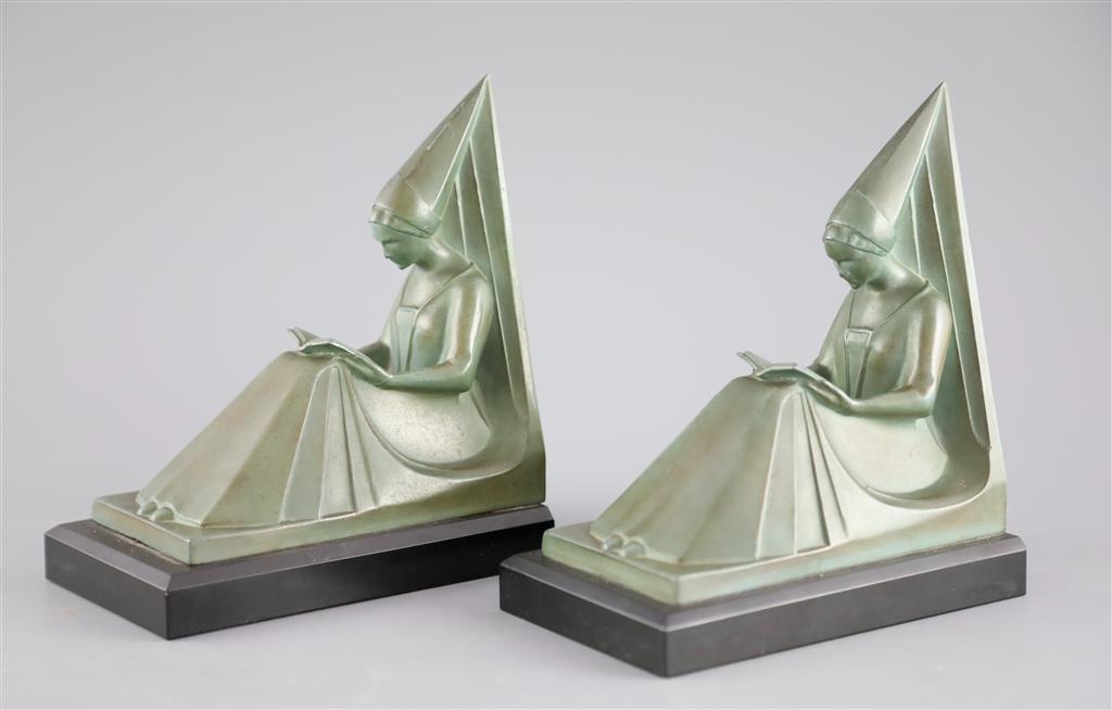 Max le Verrier. A pair of Art Deco patinated bronze bookends, height 6.75in.
